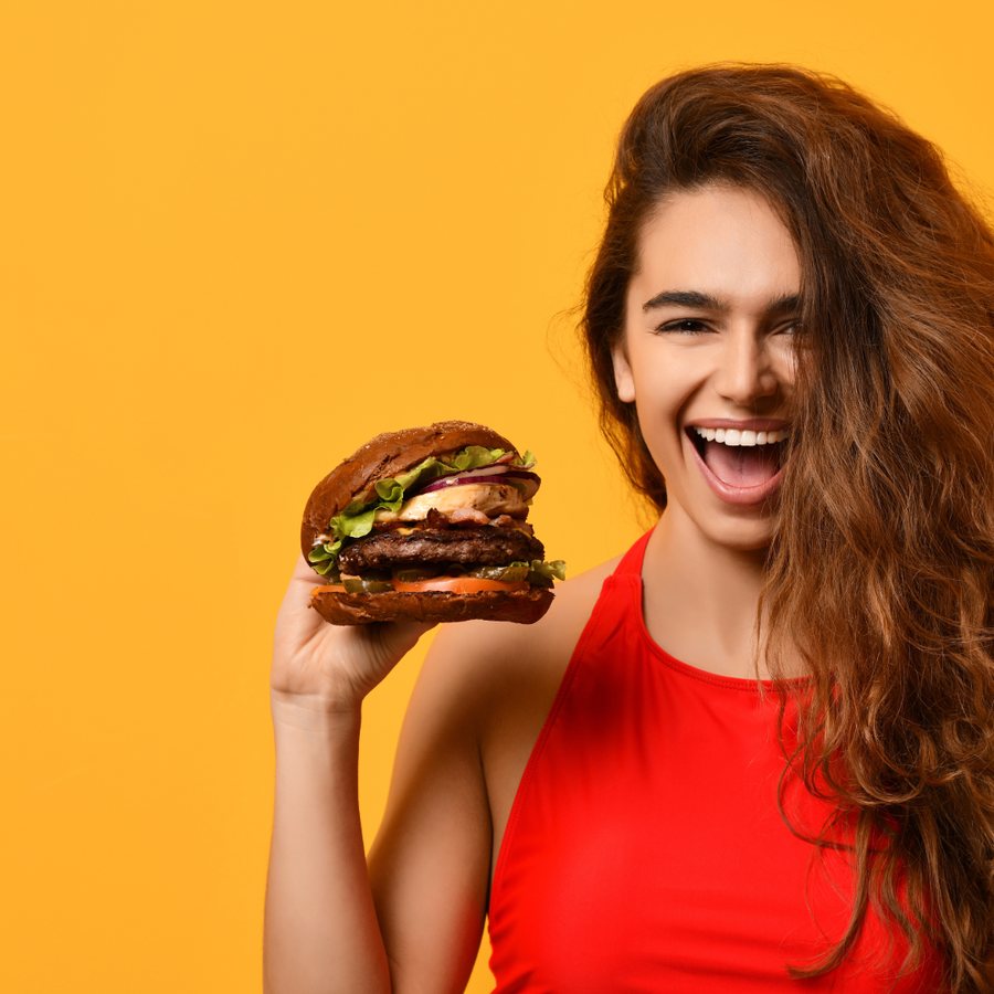 Creator holding a Greg's Burgers smashburger