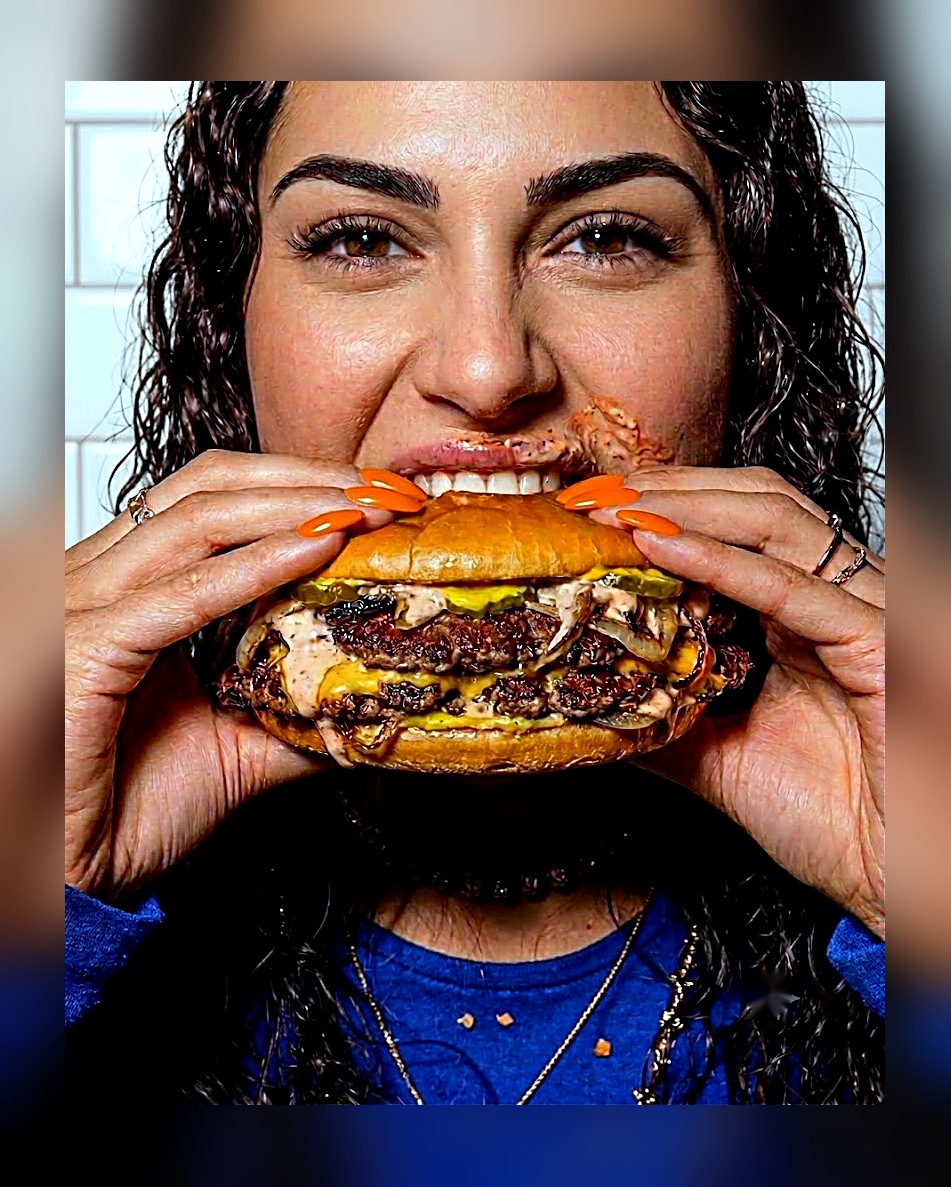 Greg's Burgers - taking a bite